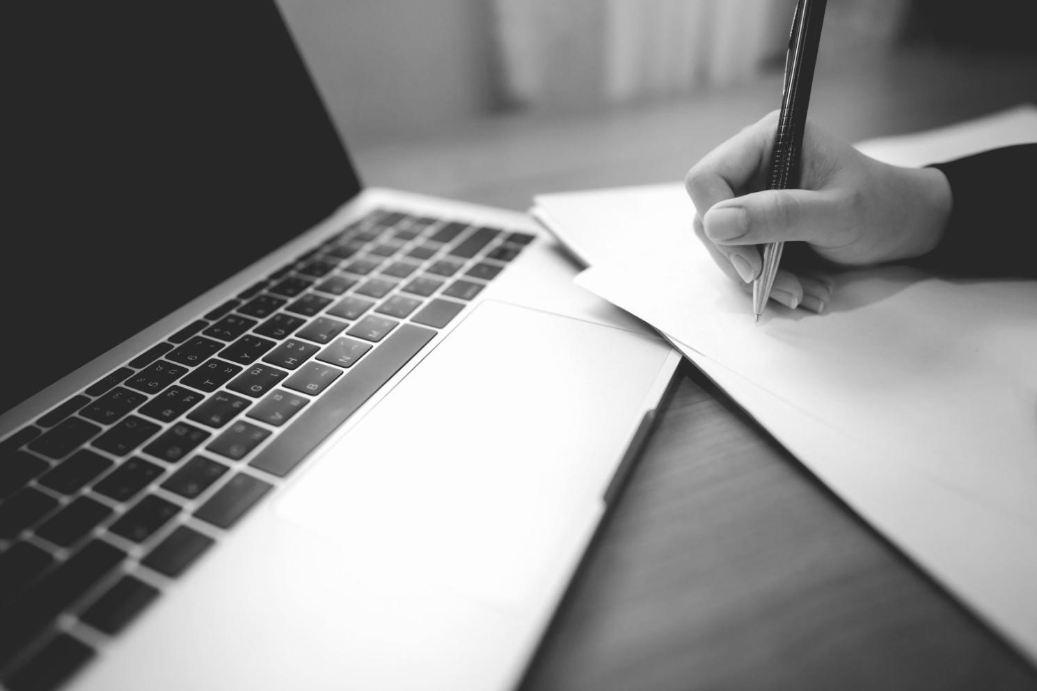 Business professional reviewing detailed financial reports and performance metrics